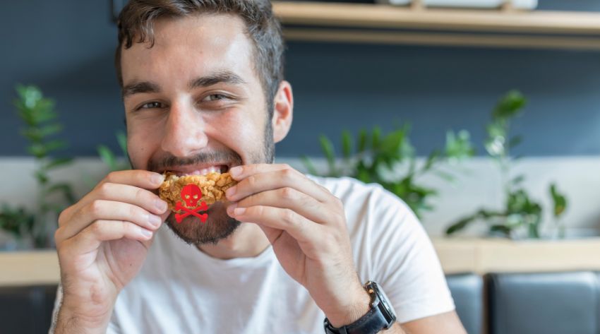 a man eating toxic chicken